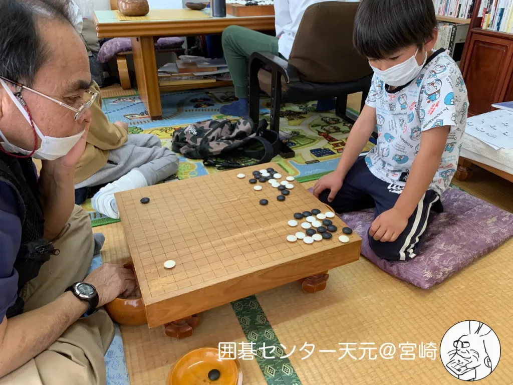 関達也プロの囲碁講座と指導碁会の様子